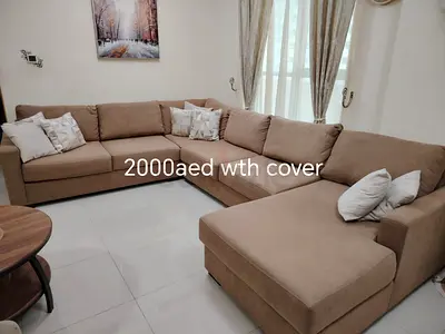Large L-shaped beige fabric sofa with chaise - good condition
