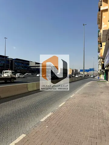للبيع بناية في مويلح – موقع مميز على شارع رئيسي محمد بن زايد