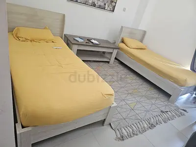 Two single beds + free table and rug