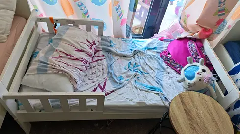 White wooden toddler bed with guard rails — good condition, home center , with mattress