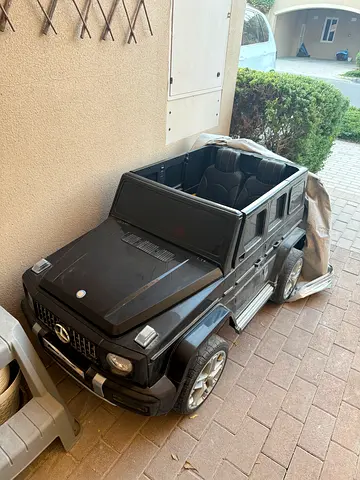 Kids ride-on Mercedes G-Class electric car - 4-seater, black