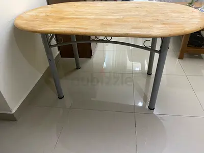 Oval wooden dining table with metal legs - compact size