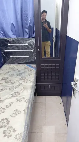 Bed with single cupboard