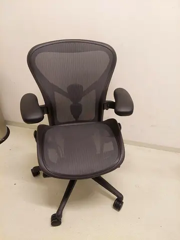 Herman Miller Aeron Remastered Chair in Size B, Graphite, is a modern marvel designed for optimal co