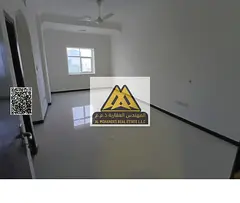 Two-bedroom apartment with living room in Al Rawda 3, Ajman, on Sheikh Ammar Street, central AC, 2 b