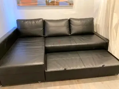 Black L-shaped Leather Sofa Bed with Storage — Good Condition