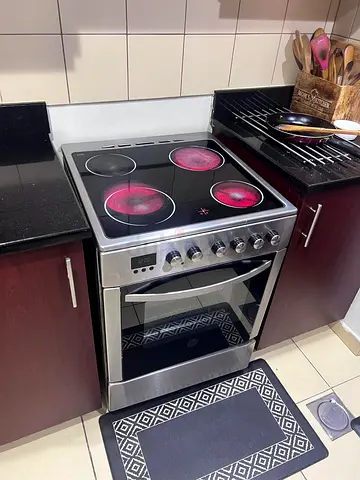 Hoover used freestanding electric cooker with oven - stainless steel. 3 electric burners working.