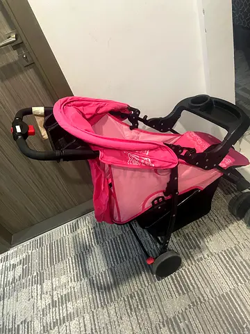 Lightweight pink baby stroller/pram - good condition