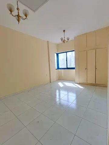 A unique, spacious apartment close to all amenities in Al Majaz 3, Sharjah. It features two bedrooms, a living room, and a balcony, with plenty of spa