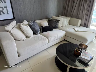 Light Beige L-Shaped Fabric Sofa with Cushions (Good Condition)