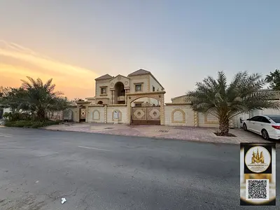 Luxury villa for sale on a 9,000 sq ft plot, with a 5,500 sq ft built-up area. It features 7 master bedrooms, 2 majlis (formal sitting rooms), a spaci