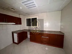 2BR apartment with hall, 2 bathrooms, built‑in wardrobes and parking in Emirates City. Annual rent