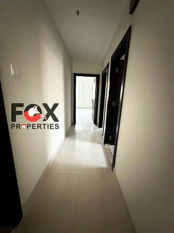 2 bedroom hall apartment for rent in Al Rawda 2 Ajman balcony 2 baths central AC spacious 4 or 6 pa