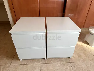 Pair of white bedside nightstands with 2 drawers each