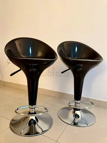 Pair of modern black adjustable bar stools with chrome base