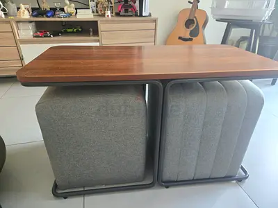 Modern compact coffee table with two upholstered ottomans (set)