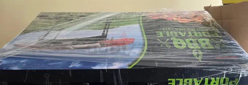 Portable foldable charcoal BBQ grill with side shelves and legs - used