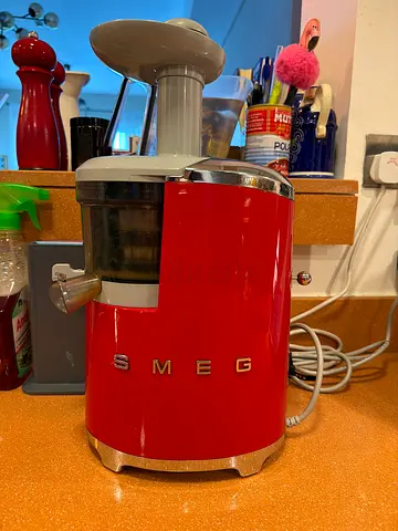 Red SMEG slow juicer — for parts only