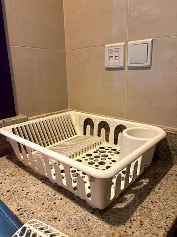 Compact white plastic dish drainer with cutlery holder