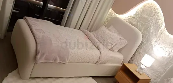 Single upholstered bed with padded headboard - cream