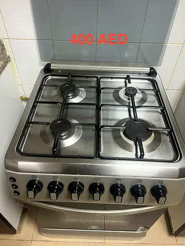 Stainless Steel 4-Burner Gas Stove with Oven - Good Condition