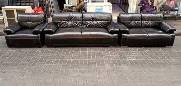 Three-piece black leather sofa set — 3-seater + 2-seater + single