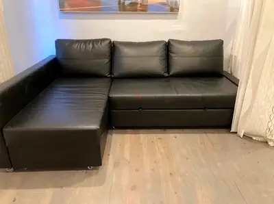 Black L-shaped Faux Leather Sofa bed with Chaise - Good Condition