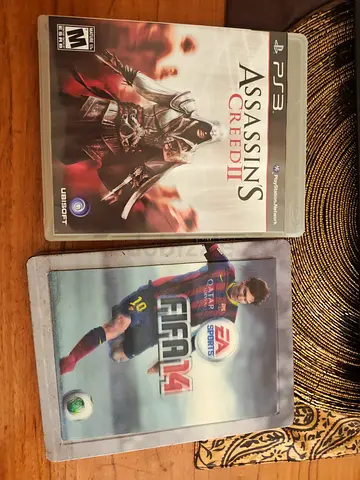 Assassins Creed II(PS3)  FIFA 14 (PS4) - Two Original Game Discs