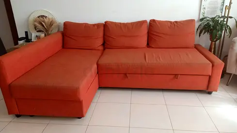IKEA L SHAPED ORANGE SOFA AED 600 WITH STORAGE