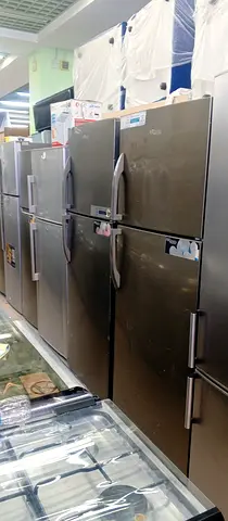 Used stainless steel double-door refrigerator - good condition