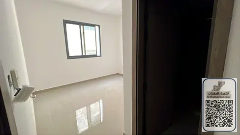 Master bedroom and living room for rent at a special price in a prime location opposite Al Hamidiya Comprehensive Police Station. Two bathrooms, close
