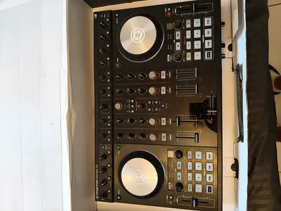 Native Instruments S4 MK2 with speaker and headphones