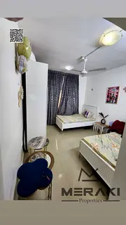 Two bedrooms and a living room, immediate occupancy, with monthly installments of 6,000 AED in the h