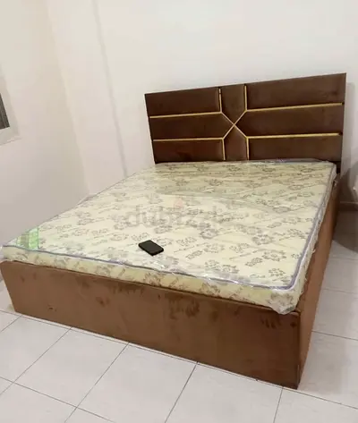 Brown upholstered double bed with mattress - good condition