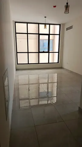 For rent in Muwaileh opposite the park: brand new 2BR + hall, 3 baths, semi-closed kitchen, free parking & gym, prime location. 🏡✨