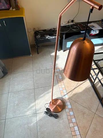 Copper/rose-gold floor lamp with adjustable arm