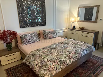 King wooden bed frame with matching bedside tables, dresser and mirror