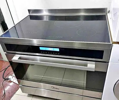 Midea Stainless Steel Induction Cooker with Oven - Good Condition 90/60 Cm