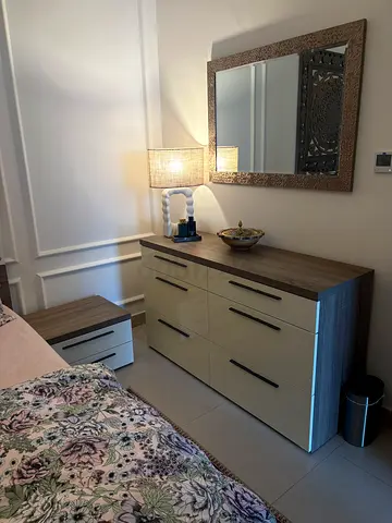 King wooden bed frame with matching bedside tables, dresser and mirror