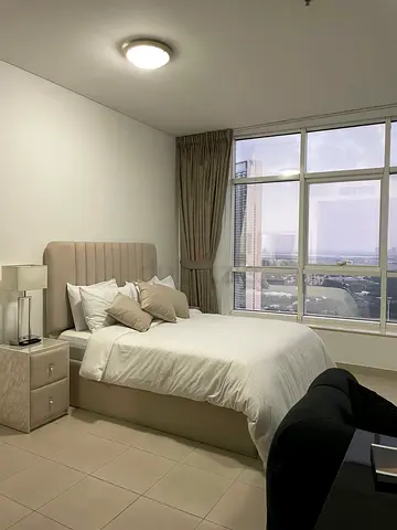 Beige upholstered queen size bed with mattress and bedside tables - good condition