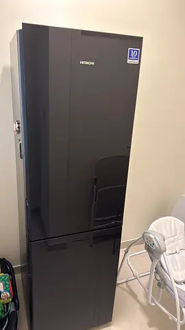 Large black refrigerator - good condition, spacious double-door