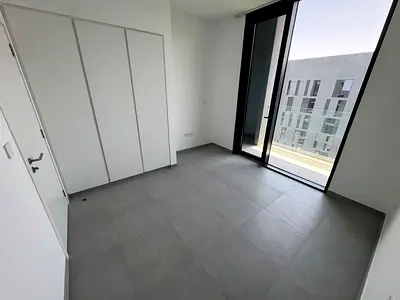 Luxurious two-bedroom apartment with a living room and three balconies available for annual rent in Sharjah, in the prestigious Arada residential comp
