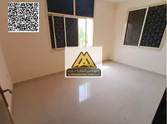 A 1-bedroom apartment with a living room for annual rent in Al Nuaimiya 2 – Ajman, featuring a goo
