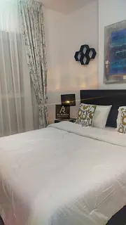 For annual rent in Ajman, in the Oasis Towers: two bedrooms, a living room, and three bathrooms; spa