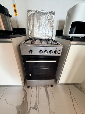 Used freestanding gas oven and 4-burner stove in good working condition