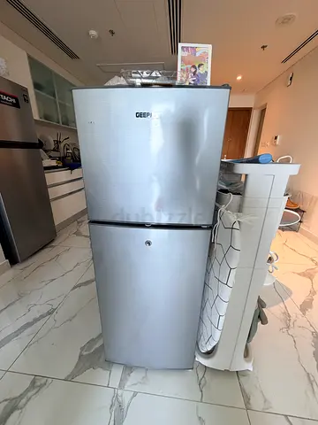Silver GEFRI Two-Door Refrigerator - Good Condition, Compact Freezer on Top