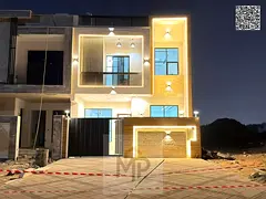 Two-story villa with a rooftop terrace, available for immediate occupancy in one of Ajman's most