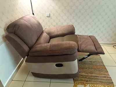 Brown two-tone reclining armchair in good condition from Home Centre