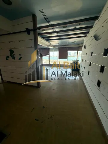 Shop in mall for rent in Al Qasba Area 870 sq Two months free Air conditioning free Prime location with a view of Khalid Lake and the lake corniche