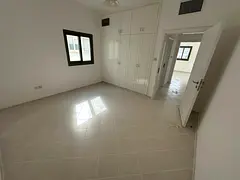 Upscale two-bedroom apartment with a living room for annual rent in Al Majaz 1. Features include bui